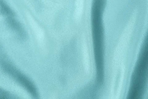 Light blue colored Background of soft draped fabric Foto stock