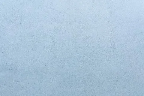 Light blue concrete wall texture with rough plastered cement surface blue wal Stock Photos