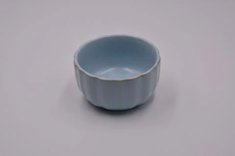 The light blue cup made of ceramic on white background Stock Photos