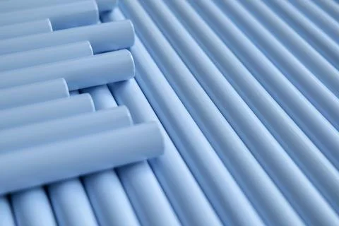 Light Blue Cylindrical Rods Arranged in Parallel Lines Stock Photos
