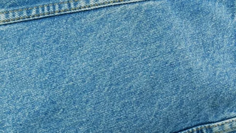Light blue denim fabric texture with seams background Stock Footage 340926620
