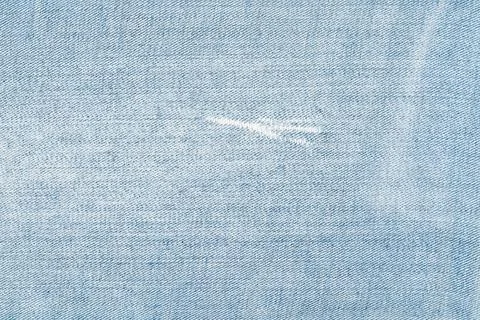 Light blue denim fabric texture with subtle white thread detail Stock Photos