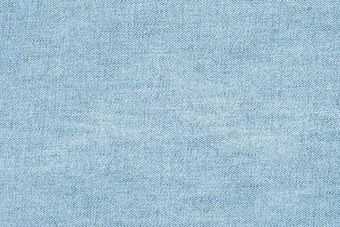 Light blue denim fabric texture closeup with diagonal weave pattern and sub.. 写真素材