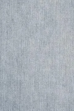 Light blue denim fabric texture surface. Detailed jeans material background.. Фото