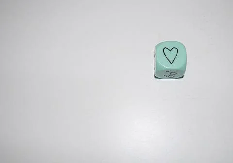 Light Blue Dice with Hand-Drawn Heart Symbol Stock Photos
