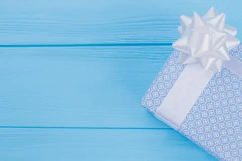 Light blue elegant gift box on wood. Stock Photos