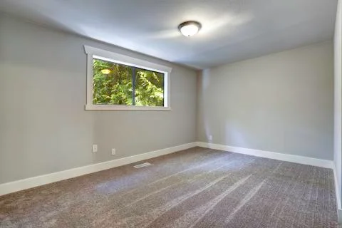 Light blue empty room with window Stock Photos