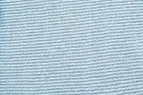 Light blue fabric texture with diagonal weave pattern Фото