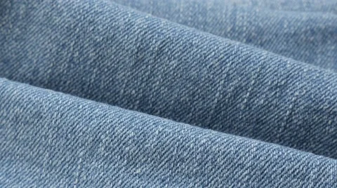 Light blue fine denim gathers and details of texture tilting 4K 2160p 30fps Stock Footage