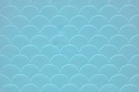 Light blue fish scale seamless pattern on decorated cement wall Stock Photos