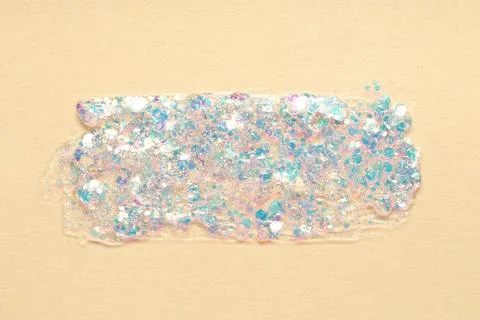 Light blue glitter stroke on beige background Stock Photos