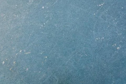Light blue ice texture with skate scratches Stock Photos