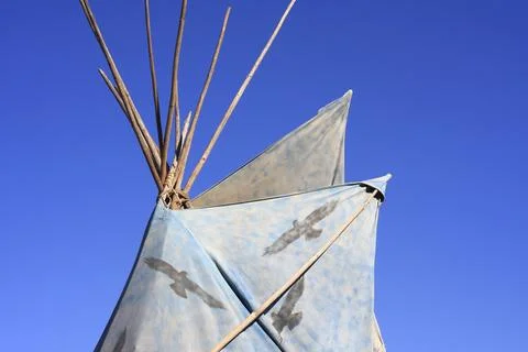 Light blue Indian tent with a pattern of black birds, background bright blue sky Stock Photos
