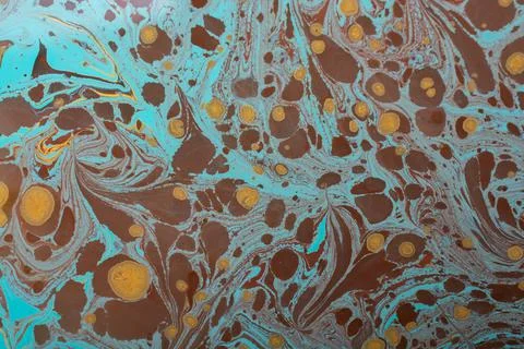 Light blue marble paper pattern background with brown and orange spots Stock Photos