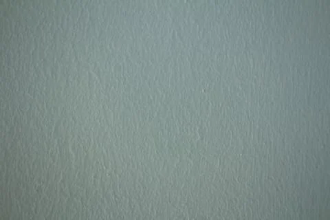 Light blue painted wall texture background with subtle roller stipple pattern Stock Photos