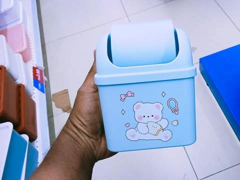 Light blue plastic mini trash can Stock Photos