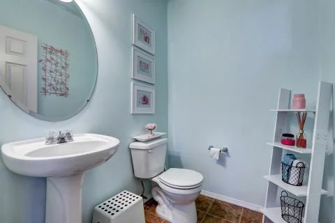 Light blue restroom with shelf Stock Photos