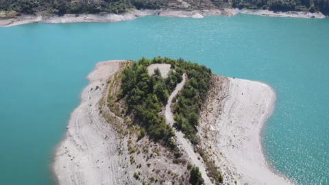 Light blue river with a pier, top view in 4k. Aerial View of Boreal Nature Stock Footage 130400744
