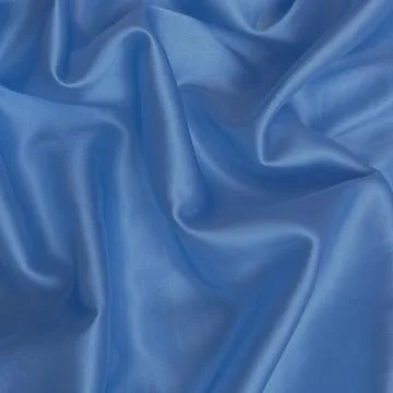 Light Blue Silk Fabric Texture Background with Soft Folds 写真素材