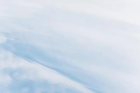 Light blue sky with clouds Stock Photos