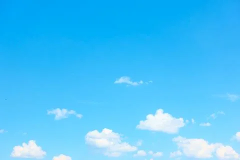 Light blue sky with white clouds Stock Photos