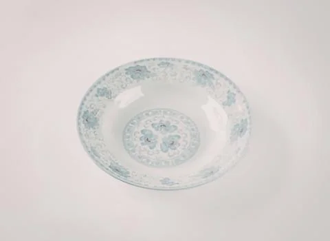 Light blue speckled ceramic shallow bowl Stock Photos