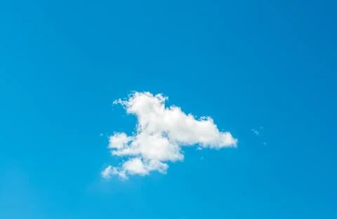 The light blue spring sky with a small clouds Stock Photos