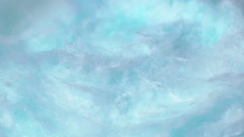 Light blue sweet fluffy cotton candy texture circle rotation close up Stock Footage 268848853