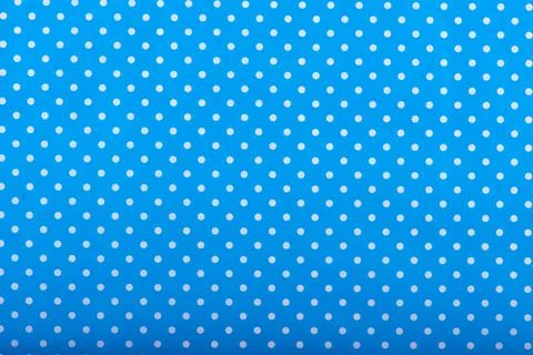 Light blue textile dot pattern seamless background . Fotos de archivo