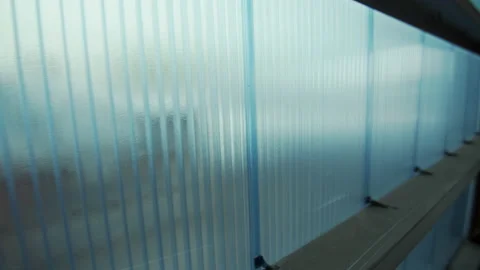 Light blue wall of innovative hollow polycarbonate panels Stock Footage 230037212