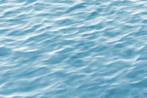 Light blue water surface background. Full frame photography. Stock Photos
