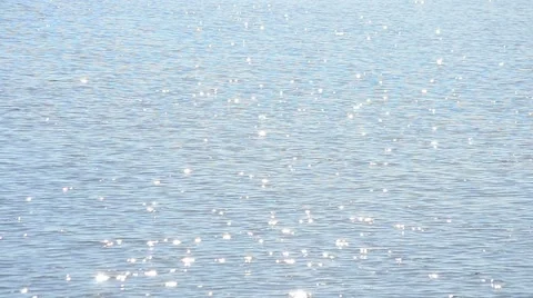 Light blue water surface glittering in the sun with sparkles Stock Footage 50948700