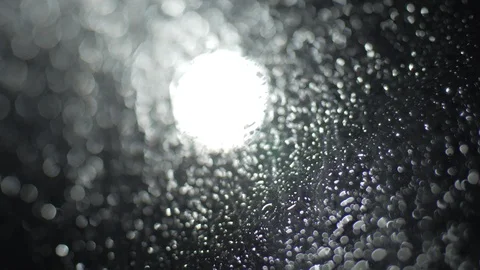 Light in blur rain drop on window Stock Footage 123289379