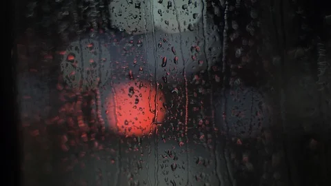 Light in blur rain drop on window Stock Footage 123289473