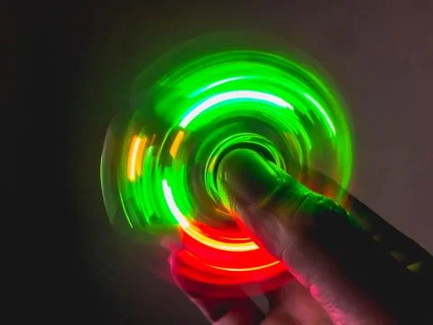 Light blurry spinning on hand Stock Photos
