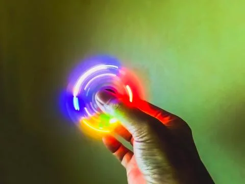 Light blurry spinning on hand Stock Photos