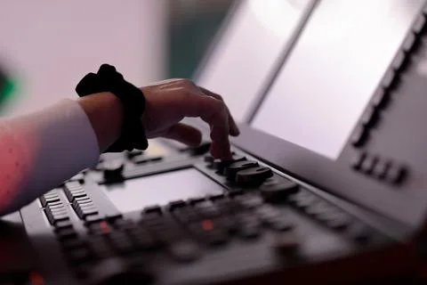 Light board operator controls the light board Stock Photos