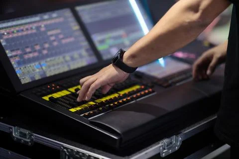 Light board operator programs control console Stock Photos