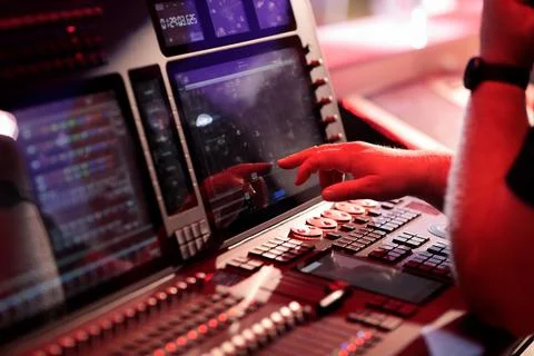 Light board operator working with control console Stock Photos