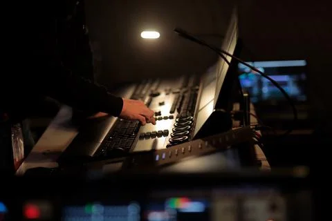 Light board operator works at the control panel Stock Photos