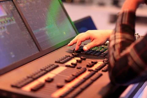 Light board operator works with lighting console Stock Photos