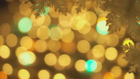 Light bokeh background from a Christmas tree. Blurry fairy-tale New Year's Stock Footage 219791396