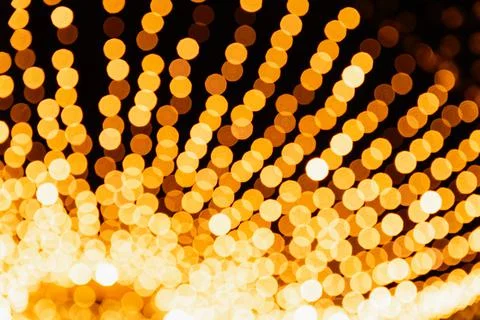Light bokeh defocused background. Blurred photo of Christmas lights. Stock Photos