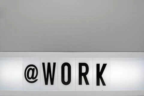 A light box with the inscription: @WORK Stock Photos