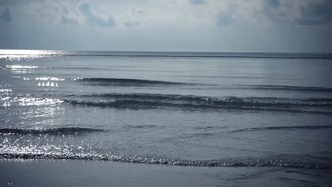 Light breeze on the sea, the waves roll on the shore and glisten from the sun Stock Footage 96611683
