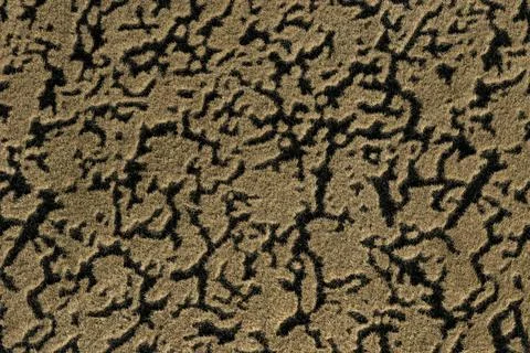 Light brown and black background from textile with wave abstract pattern. Stock Photos