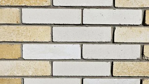 Light brown brick wall, abstract background texture. Stock Photos