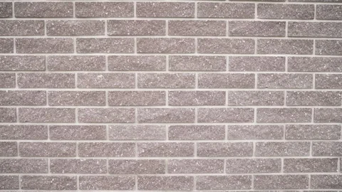 Light brown brick wall background texture seamless looping animation Video stock 305025533