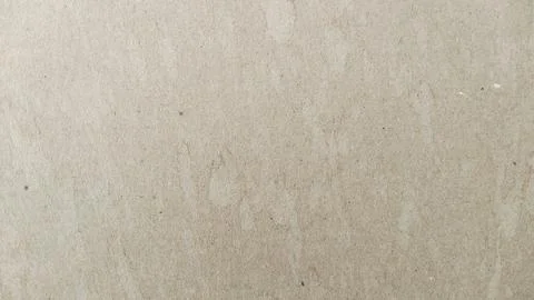 Light brown cardboard texture background with organic fiber patterns. Stockfoto's