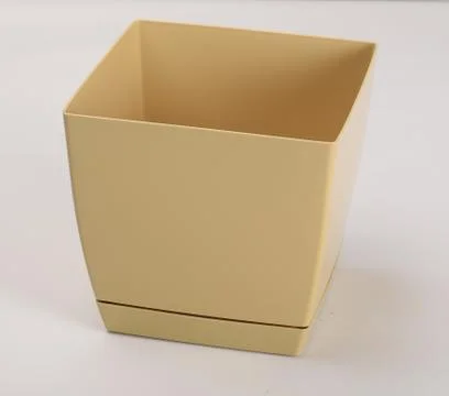 Light brown empty plastic flowerpot Фото